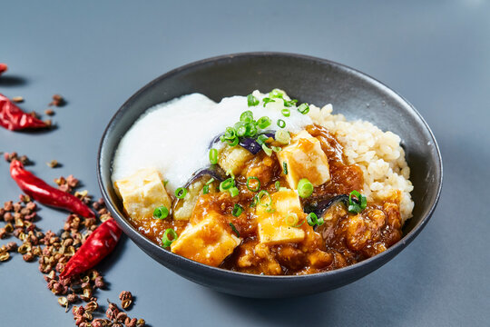 Mapo tofu rice bowl with grated yam and green onion