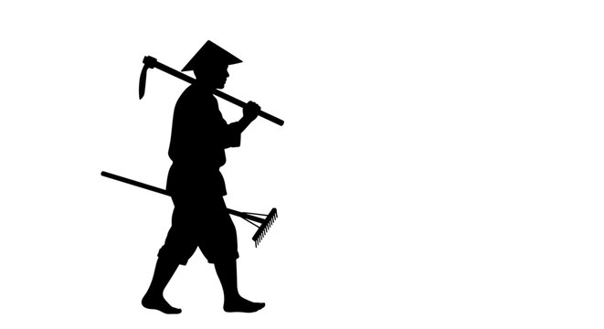 Man carrying pickaxes on shoulder.