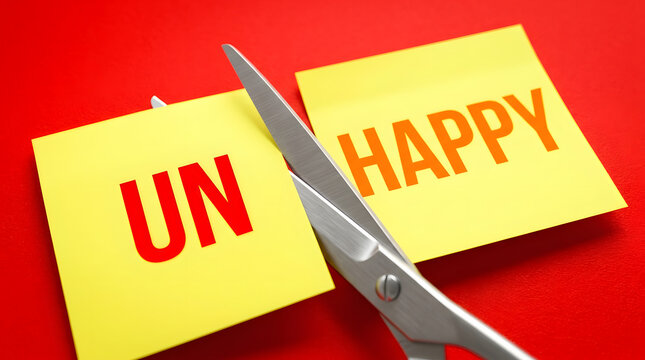 Scissors cutting unhappy to happy on sticky notes
