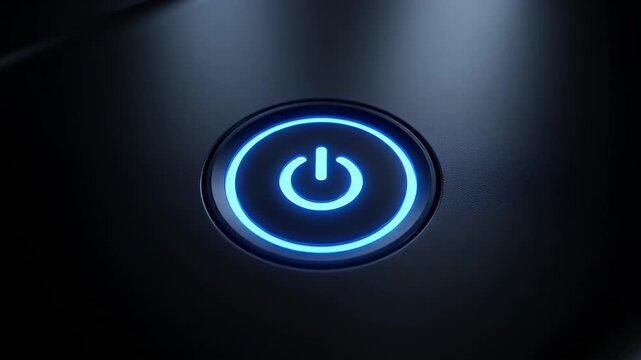 A glowing blue power button with a universal power symbol is illuminated on a dark, sleek surface.