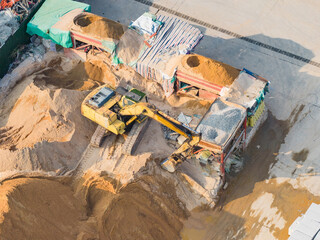 Fototapeta premium Drone view over excavator for sand and crushed stone loading