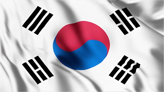Waving flag of South Korea captured in motion showing vibrant national colors and traditional Taegeuk symbol for patriotic display or celebration background.