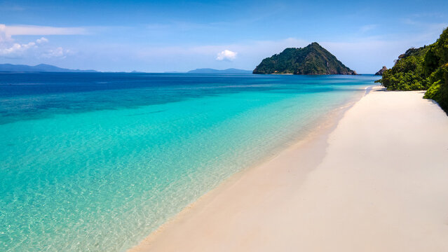 Beautiful Andaman sea in Myanmar. Turquoise crystal clear water and white soft sand of Madam Beach, Nyaung Oo Phee Island in the Mergui Archipelago, Burma.
