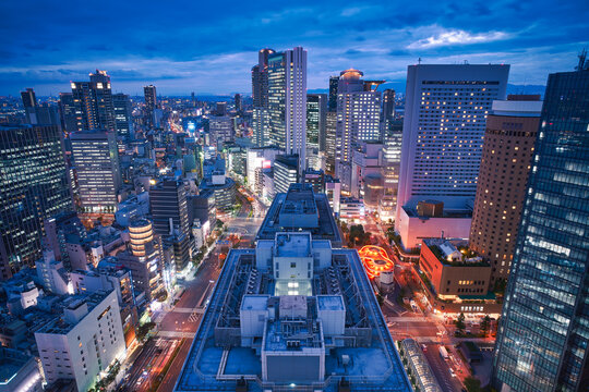 Osaka city skyline - asia modern business city, cityscape birds eye view in evening, shot in Osaka ekimae daisan (third) building, Osaka, Japan.