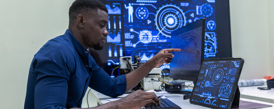 Black Researcher Making a Quantum Computing Experiment, Monitoring Live Artificial Intelligence Data on Computer Screen,