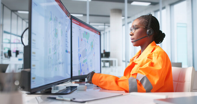 Young Woman In Emergency Call Center Calmly Managing Urgent 911