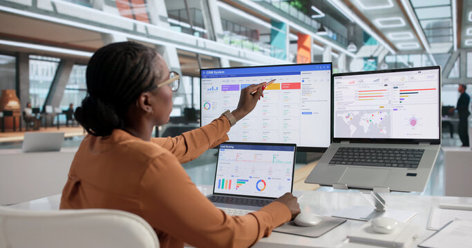 African American Woman Using CRM Software