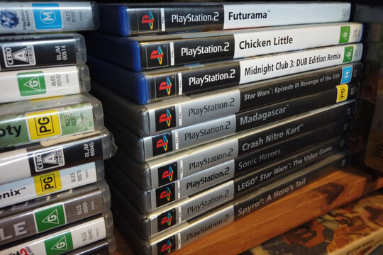 North Haven, South Australia - July 5 2026: Stack of PlayStation 2 video game cases on a shelf
