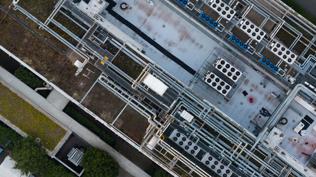 Aerial view of Data Center Dusseldorf 1 in Germany, providing enterprise cloud services and large-scale computing with rooftop HVAC and cooling systems.