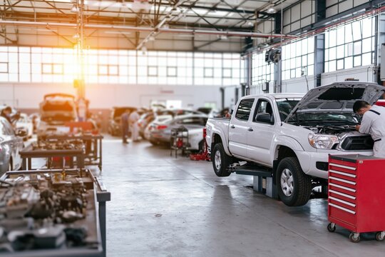 The Car Workshop in Action: Modern Auto Repair Shop with Tools and Lifts