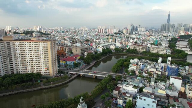 Aerial view over densely populated residential districts and Nhi Nhieu canal in Ho Chi Minh City Vietnam.