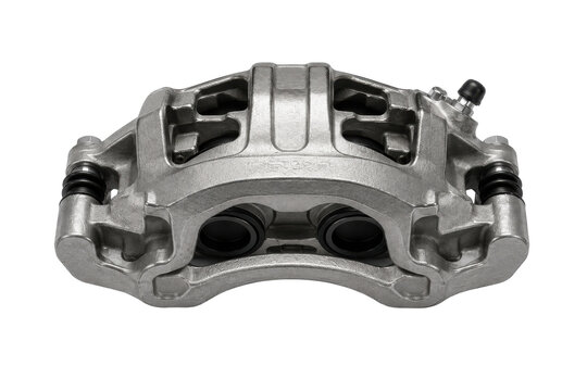 A close-up view of a metallic brake caliper on a vehicle showing detailed mechanical parts.
