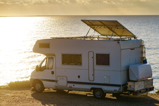 Caravan with tilt solar panels on roof.