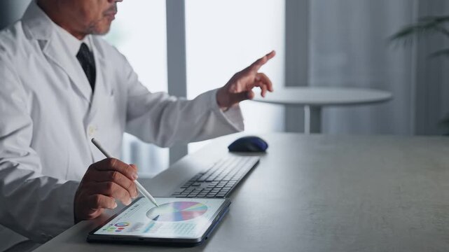 A man in a white coat working on a tablet PC. DX, VR, IT, science, research, development, medical, university, engineer.
