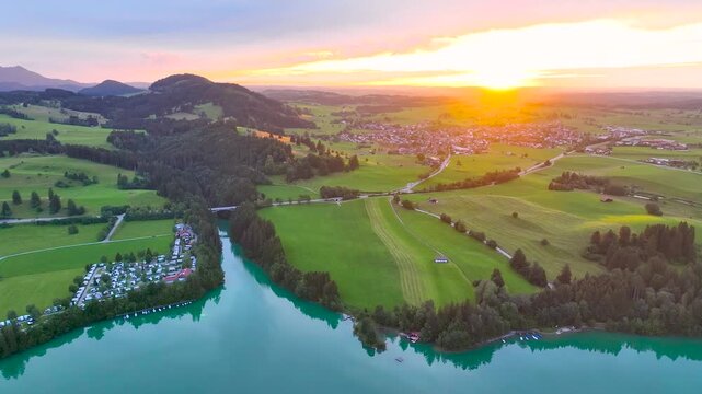 Aerial view of the Lake Forggensee in Alps in the evening, Germany, Europe