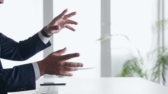 A male business professional interacting with a screen in mid-air. VR, virtual, office, business, operation, touch, IT.
