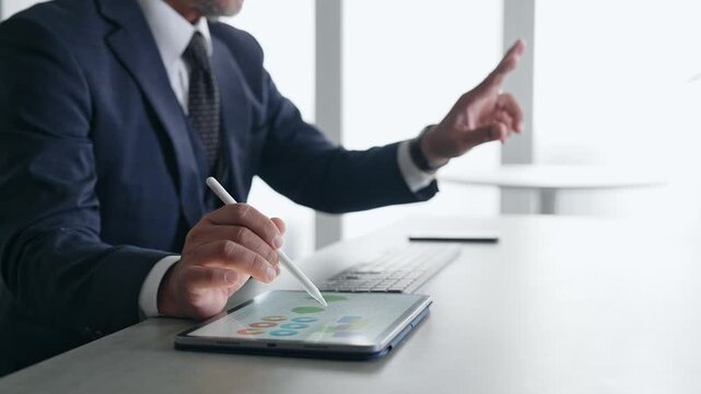 A man working on a tablet PC. DX, VR, operation, touch, business, office, control, IT.
