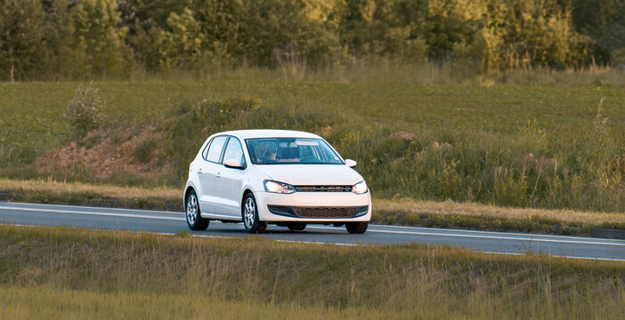 Front view of hatchback on summer drive