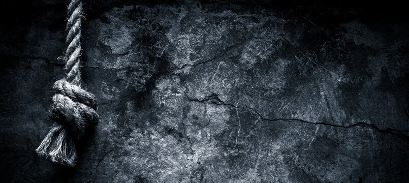 Hanged rope on grunge dark stone wall background. Generative AI technology.	