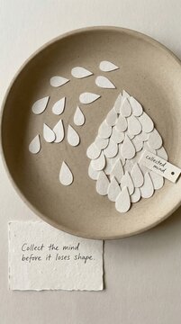 Paper Craft Art Installation 'Collected Mind' with White Teardrops on a Plate, Perfect for Low Attention Span Audiences
