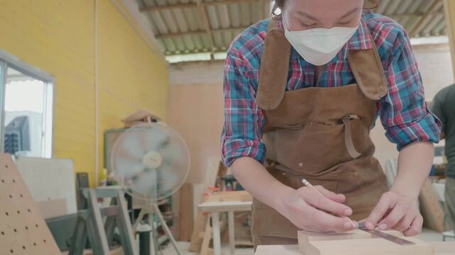 A dedicated artisan works meticulously in a woodworking workshop, showcasing skill and precision in crafting wood. The vibrant setting highlights tools and materials, creating an atmosphere of creativ