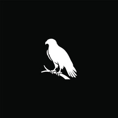 Fototapeta premium White eagle silhouette perched on a branch.