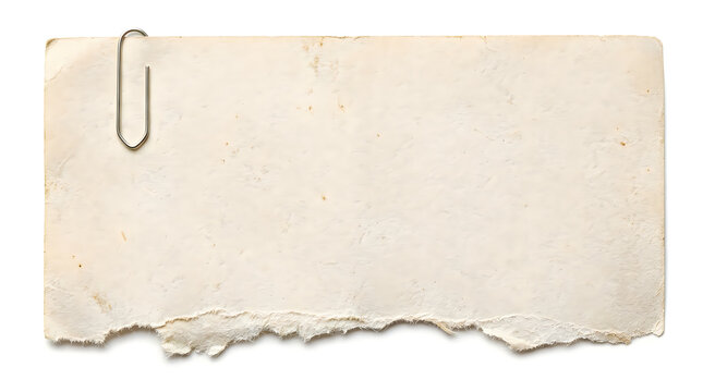 Old torn piece of paper with a metal paper clip attached to the top left corner for school work