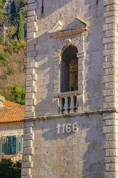 Montenegro. Old Town of Kotor.  Cathedral of Saint Tryphon, window of tower. Detail
