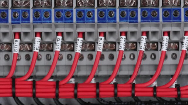 Marking electrical wiring wires with thermally printed nylon tape. 