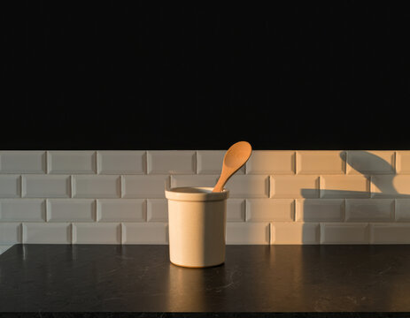 Dark Soapstone Countertop with Spoon Crock Kitchen Backdrop for culinary brand banner campaigns and culinary marketing, with clean copy space in the upper frame for text overlays and safe vertical cro
