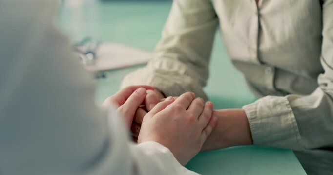 Doctor comforting patient during consultation