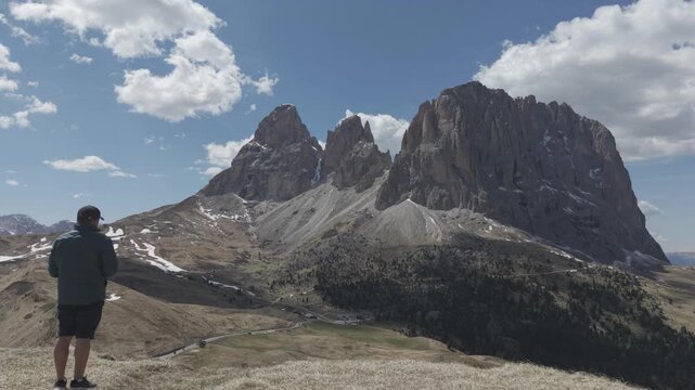 Majestic Alpine Mountain Peaks with Valley Road and Buildings