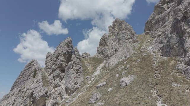 Dramatic Snow-Capped Jagged Mountain Peaks Under Blue Sky