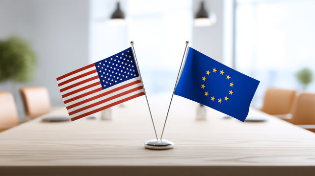 USA and European Union desk flags facing each other in a modern meeting room, symbolizing diplomacy, international cooperation and transatlantic relations