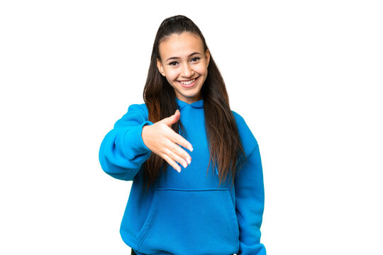 Young Arabian woman over isolated chroma key background shaking hands for closing a good deal