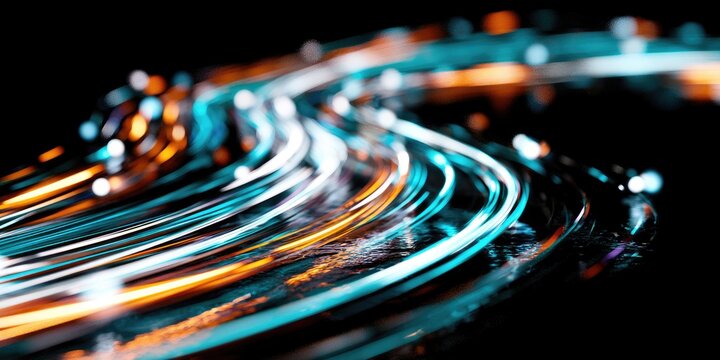 Swirling abstract trails of light in vibrant turquoise, orange, and white against black