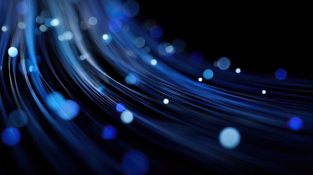Flowing blue light streams with soft bokeh against a dark background