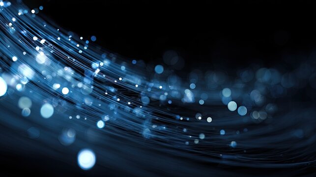 Swirling luminous blue strands with glowing particles against dark backdrop