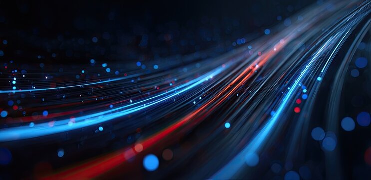Streaks of blue and red light flow across a dark, abstract background