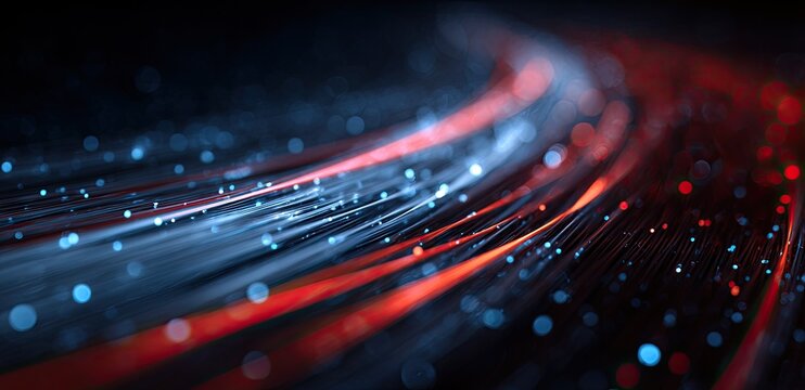 Streaks of light and glowing particles flow dynamically across a dark background