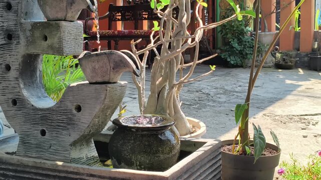 Mini Garden Fountain with House Yard Copy Space for Home Decoration Background Video