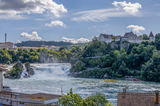 SCHAFFHAUSEN, SWITZERLAND, JULY 23, 2025 - View of Rhine Falls (Rheinfall) and the Laufen Castle near Schaffhausen, Switzerland, known as the largest waterfall in Europe by width.