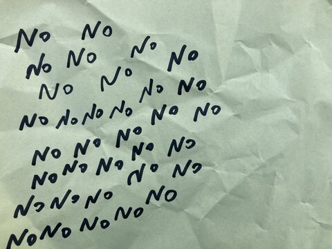 word No written on wrinkled paper, handwritten text, The answer yes is written in letters of words no, on crumpled paper, showing the hidden meaning and ambiguity of the agreement
