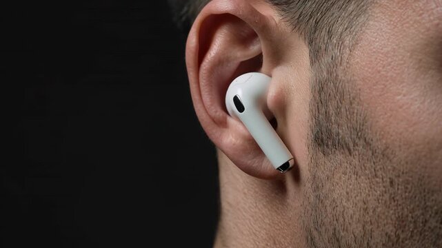 Wireless earbud, man and music in ear with listening, technology and audio equipment for entertainment. Person, headphone and accessory with sound, mobile lifestyle and gadget for communication