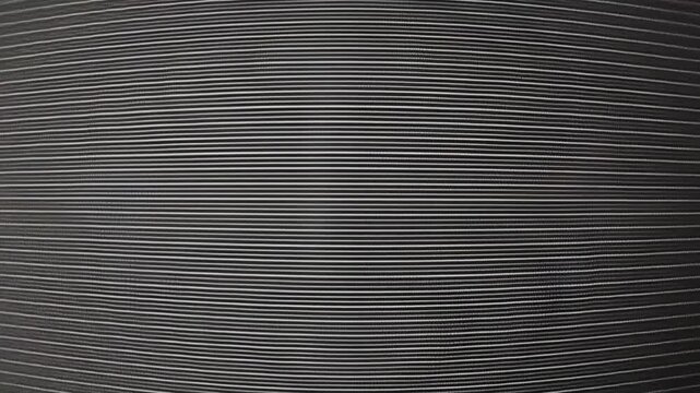 analog VHS video noise texture with horizontal lines and flickering distortion. The image shows a vintage television screen effect with static, and scanlines.