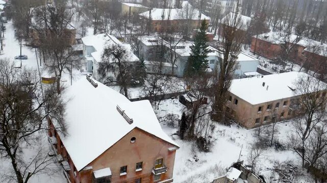 Voronezh, Russia, January 3, 2026: Winter residential area of ​​Voronezh with private sector and multi-story buildings, view from above