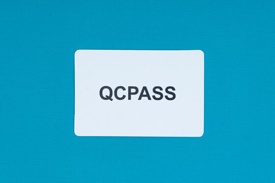 qc pass validation tag on blue background for quality management systems and industrial manufacturing standard compliance checks