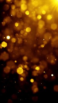 Floating golden bokeh light particles, vertical video featuring elegant festive sparkle effects, glowing illumination and luxurious celebration atmosphere