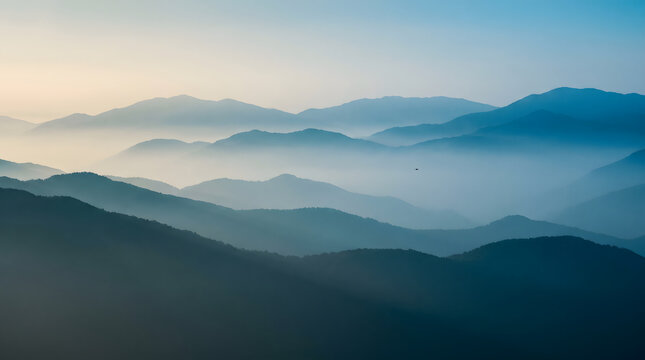 Misty Blue Mountain Layers at Sunrise with Soft Atmospheric Landscape