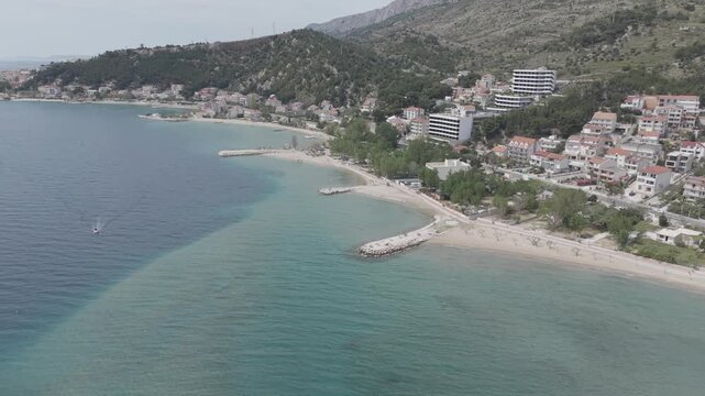 Aerial View of Mediterranean Coastal Town and Turquoise Bay